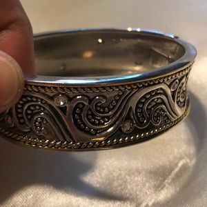 Silver and gold bangle; moderate weight